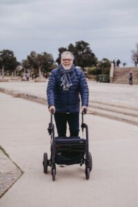 elderly person using a walking aid elderly person using a walking aid
